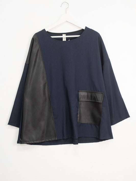 Blusa ecopelle tasca