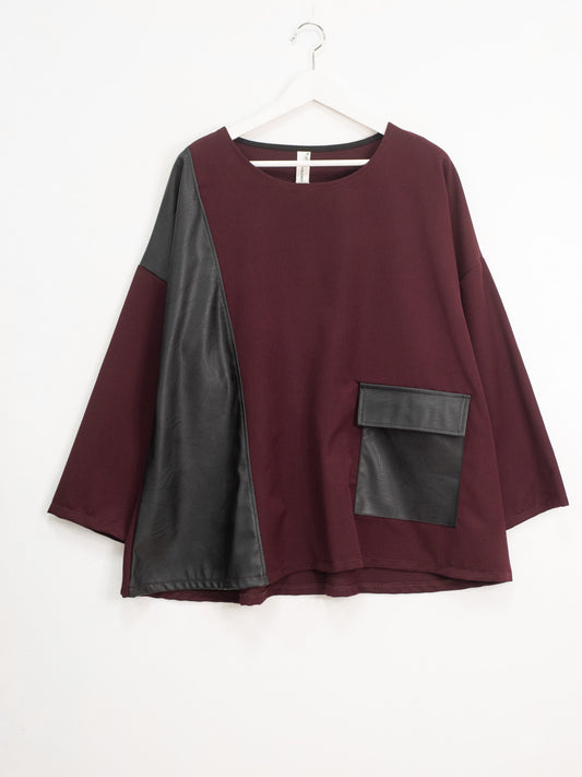 Blusa ecopelle tasca
