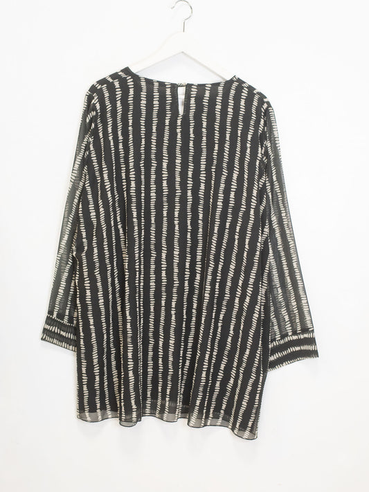 Striped and polka dot patterned blouse